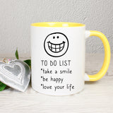 Tasse Weiß/Gelb bedruckt mit Spruch: TO DO LIST *take a smile *be happy * love your life