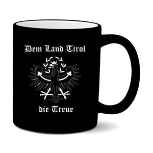 Tasse aus Keramik mit gummierter Außenfläche, die der Tasse eine besonders schöne Haptik verleiht.  Das Motiv und Schriftzug Dem Land Tirol die Treue und den Tiroler Adler wird auf auf einer Seite der Tasse.