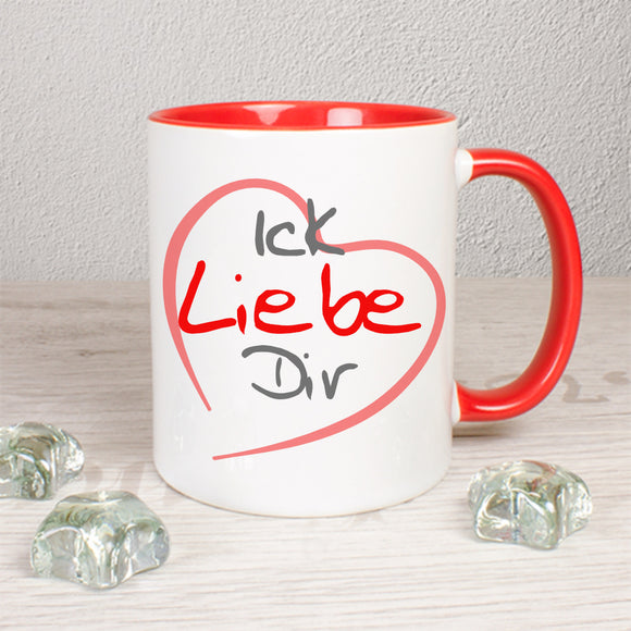 Tasse Weiß/Rot bedruckt mit Herz und darin steht: Ick Liebe Dir