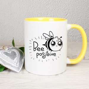 Tasse Weiß/Gelb bedruckt mit Spruch: Bee positive mit Biene
