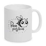 Tasse Weiß bedruckt mit Spruch: Bee positive mit Biene