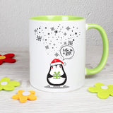 Tasse Weiß/Grün bedruckt mit Spruch: Life is a gift. - Motiv: Schneeflocken und Pinguin - Farbe Geschenk: Grün