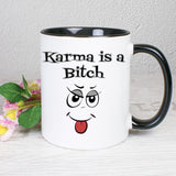 Tasse Weiß/Schwarz bedruckt mit Spruch: Karma is a Bitch - mit Smiley Zunge