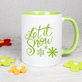 Tasse Weiß/Grün bedruckt mit Spruch: Let it snow - Motiv: Schneeflocken - Farbe: Grün