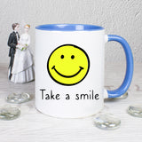 Tasse Weiß/Blau mit Smiley und Spruch bedruckt: Take a smile