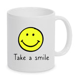 Tasse Weiß mit Smiley und Spruch bedruckt: Take a smile