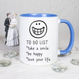 Tasse Weiß/Blau bedruckt mit Spruch: TO DO LIST *take a smile *be happy * love your life 