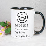 Tasse Weiß/Schwarz bedruckt mit Spruch: TO DO LIST *take a smile *be happy * love your life 