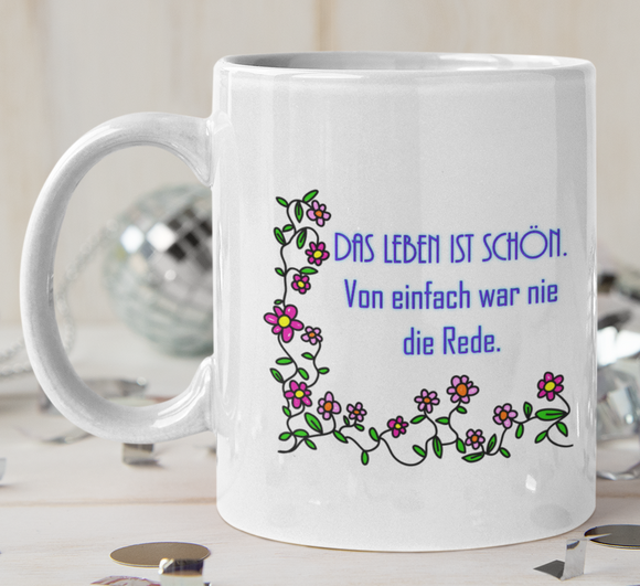 Tasse Weiß bedruckt mit Spruch: Das Leben ist schön. Von einfach war nie die Rede - Motv: Blumen