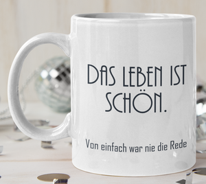 Tasse Weiß bedruckt mit Spruch: Das Leben ist schön. Von einfach war nie die Rede